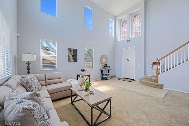 750 Multnomah Ct, San Jacinto, CA 92582 - carpeted living area featuring a towering ceiling and stairs