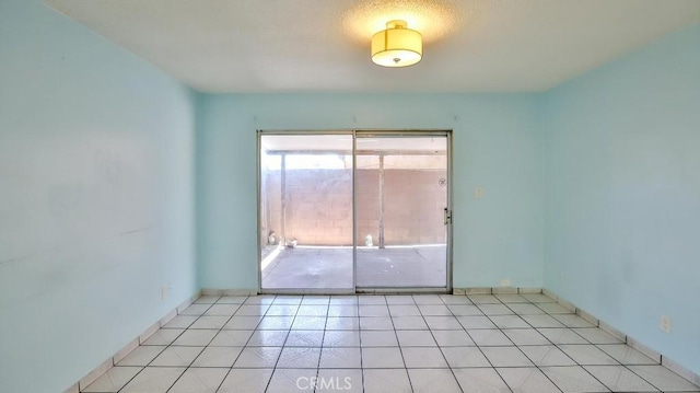 1531 E Ln Palma Ave Unit C2, Anaheim, CA 92805 - spare room with light tile patterned floors and baseboards