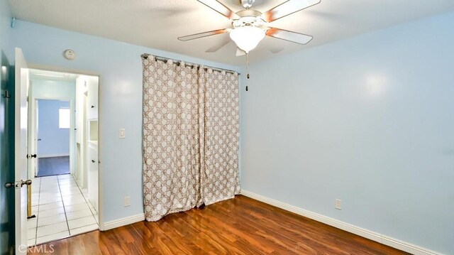 1531 E Ln Palma Ave Unit C2, Anaheim, CA 92805 - empty room featuring a ceiling fan, wood finished floors, and a smoke detector
