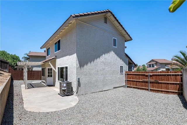 14791 Mountain High Dr, Fontana, CA 92337 - rear view of house with a pergola, a patio, stucco siding, a fenced backyard, and a tiled roof