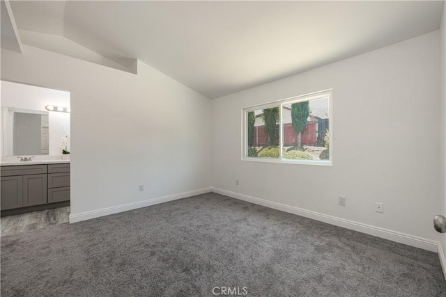 14791 Mountain High Dr, Fontana, CA 92337 - unfurnished bedroom featuring lofted ceiling, carpet floors, and ensuite bath