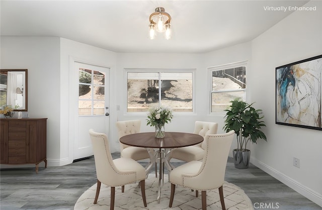 14791 Mountain High Dr, Fontana, CA 92337 - dining space featuring wood finished floors and a chandelier