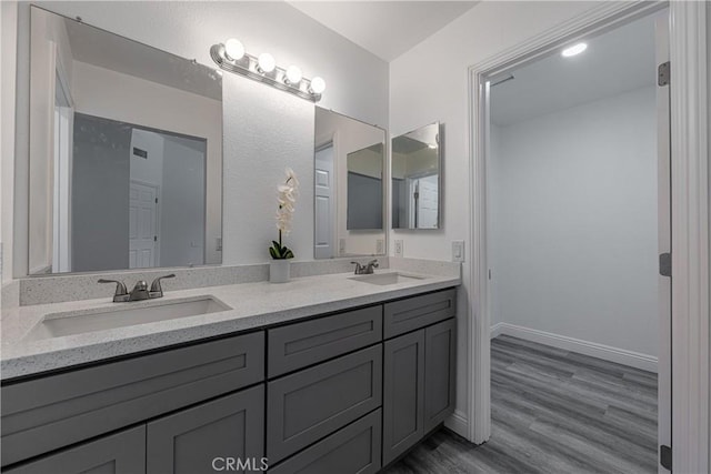 14791 Mountain High Dr, Fontana, CA 92337 - bathroom featuring double vanity and wood finished floors