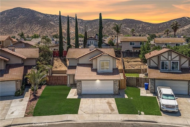 14791 Mountain High Dr, Fontana, CA 92337 - view of front of home with a tile roof, a mountain view, stone siding, and a residential view