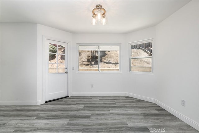 14791 Mountain High Dr, Fontana, CA 92337 - unfurnished dining area featuring baseboards and wood finished floors
