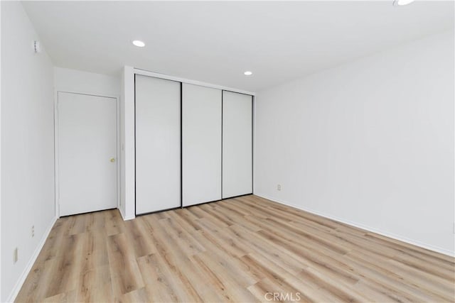 1119 Albany St Unit 226, Los Angeles, CA 90015 - unfurnished bedroom with recessed lighting, light wood finished floors, and a closet
