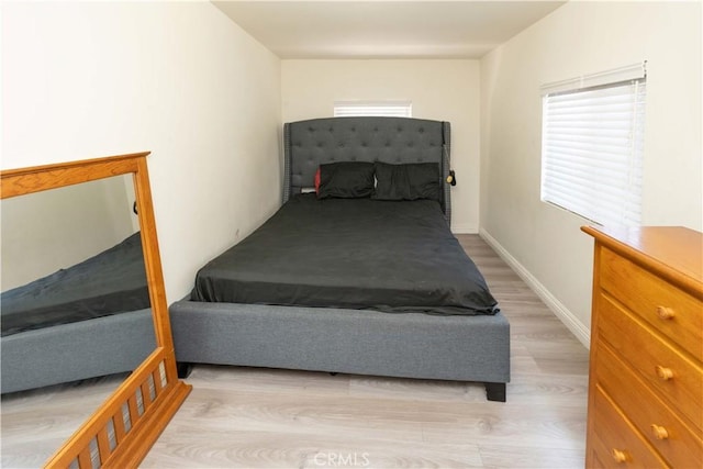 285 W 9th St, San Pedro, CA 90731 - bedroom with light wood finished floors and baseboards