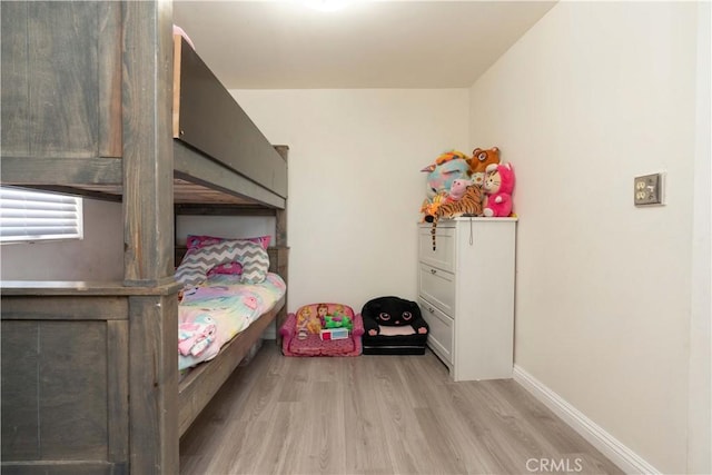 285 W 9th St, San Pedro, CA 90731 - bedroom with light wood-type flooring and baseboards