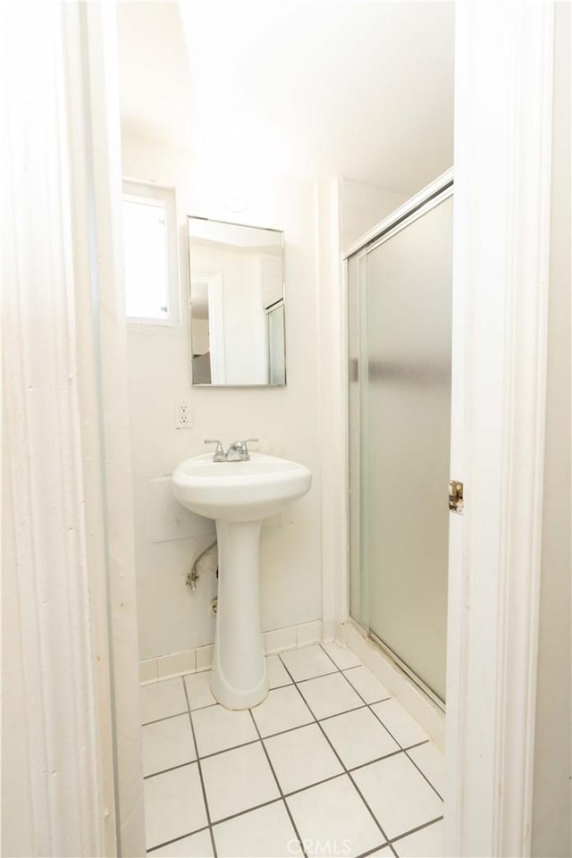 285 W 9th St, San Pedro, CA 90731 - bathroom with tile patterned floors and a stall shower