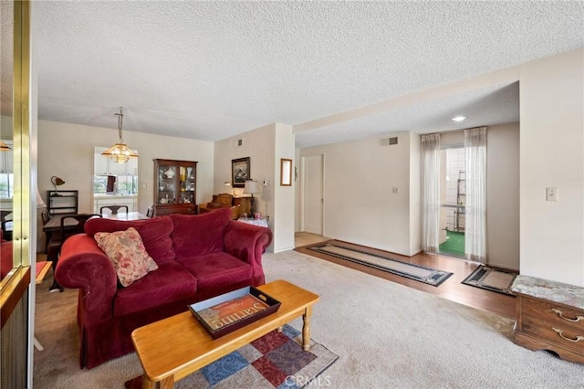 19309 Flowers Ct, Newhall, CA 91321 - carpeted living area featuring a textured ceiling