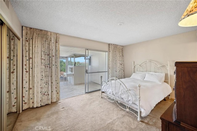 19309 Flowers Ct, Newhall, CA 91321 - carpeted bedroom with access to exterior and a textured ceiling