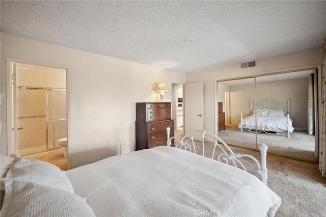 19309 Flowers Ct, Newhall, CA 91321 - carpeted bedroom featuring a textured ceiling, a closet, and connected bathroom