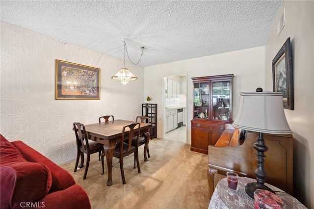 19309 Flowers Ct, Newhall, CA 91321 - dining space with a textured ceiling, light colored carpet, a chandelier, and wallpapered walls