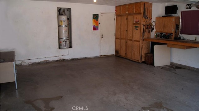 7390 Chase Ave, Hesperia, CA 92345 - garage featuring water heater and a workshop area