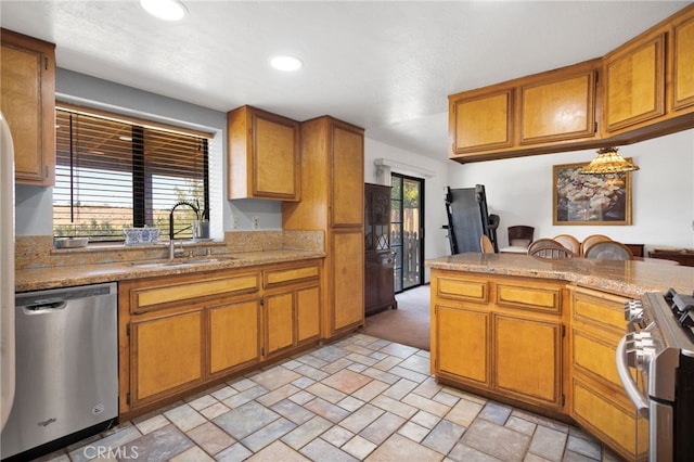 7390 Chase Ave, Hesperia, CA 92345 - kitchen with appliances with stainless steel finishes, brown cabinets, recessed lighting, and light stone finish flooring