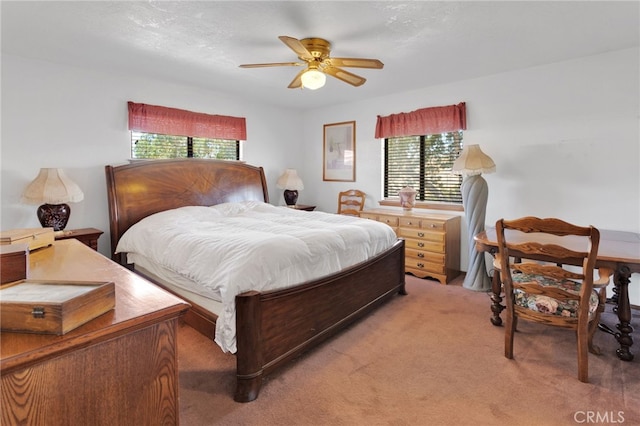 7390 Chase Ave, Hesperia, CA 92345 - bedroom featuring multiple windows, light colored carpet, and ceiling fan