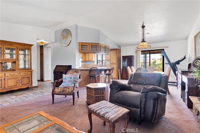 7390 Chase Ave, Hesperia, CA 92345 - living room featuring lofted ceiling, light carpet, and a baseboard heating unit