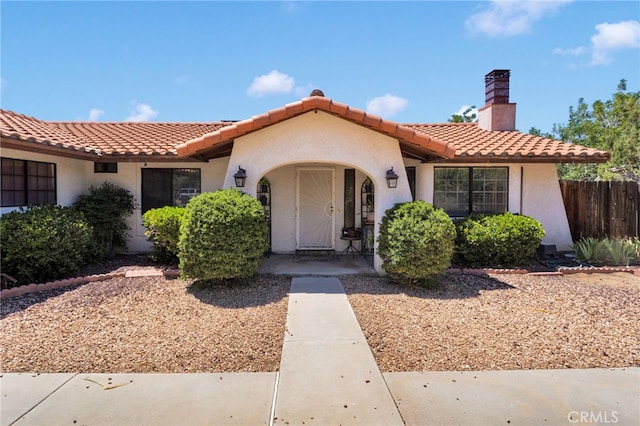 7390 Chase Ave, Hesperia, CA 92345 - mediterranean / spanish house with a tile roof, stucco siding, and a chimney