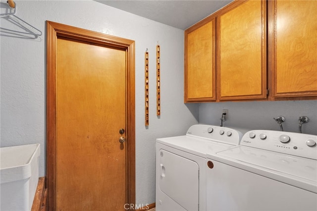 7390 Chase Ave, Hesperia, CA 92345 - laundry area with washing machine and dryer and cabinet space