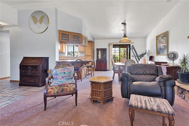 7390 Chase Ave, Hesperia, CA 92345 - living room with vaulted ceiling, light colored carpet, and stone tile floors