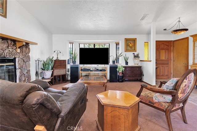 7390 Chase Ave, Hesperia, CA 92345 - carpeted living area with a stone fireplace and a textured ceiling