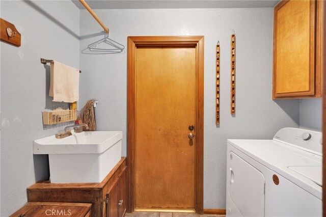 7390 Chase Ave, Hesperia, CA 92345 - washroom featuring cabinet space and independent washer and dryer