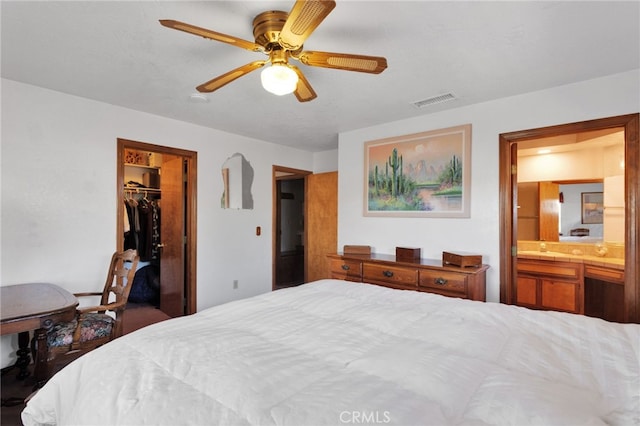 7390 Chase Ave, Hesperia, CA 92345 - bedroom featuring a closet, connected bathroom, a spacious closet, and ceiling fan