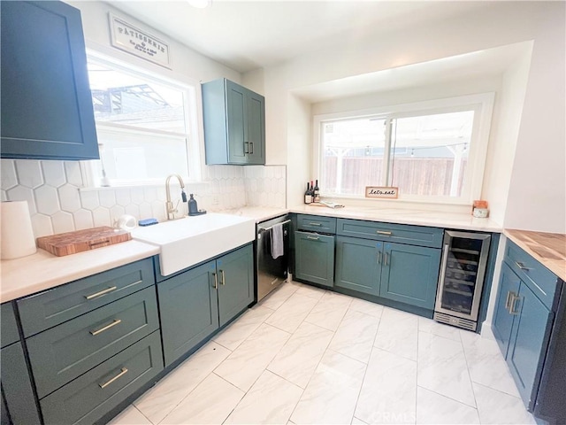 4574 Whaley Ave, Long Beach, CA 90807 - kitchen featuring wine cooler, dishwasher, light marble finish floors, tasteful backsplash, and light countertops