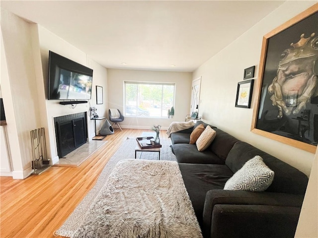 4574 Whaley Ave, Long Beach, CA 90807 - living area with light wood finished floors and a fireplace with raised hearth