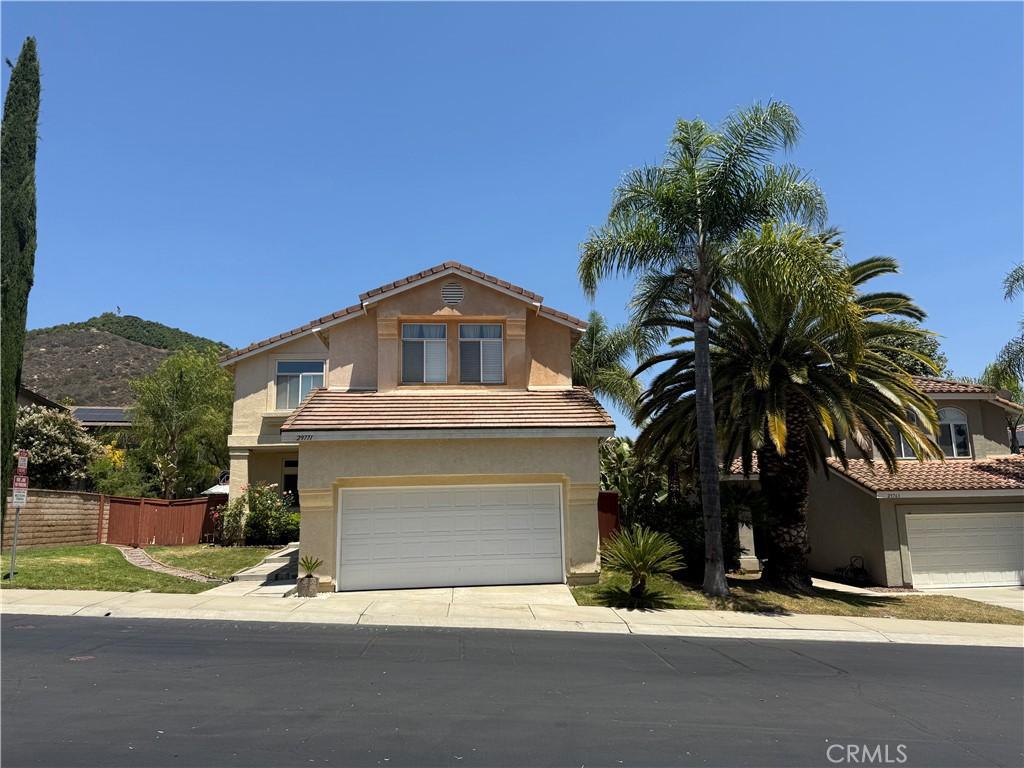 29771 Circle R Ct, Escondido, CA 92026 - traditional-style house with a garage, stucco siding, a tile roof, and concrete driveway