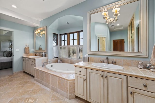 1559 Rolling Hills Rd, Santa Ynez, CA 93460 - full bath featuring a chandelier, two vanities, a garden tub, and tile patterned floors