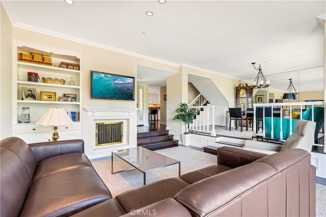 38 Canyon Island Dr Unit 38, Newport Beach, CA 92660 - living room featuring stairway, crown molding, built in features, a fireplace, and a chandelier
