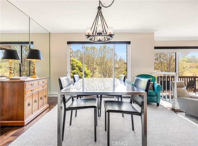 38 Canyon Island Dr Unit 38, Newport Beach, CA 92660 - dining space with a chandelier, plenty of natural light, dark wood-type flooring, and crown molding