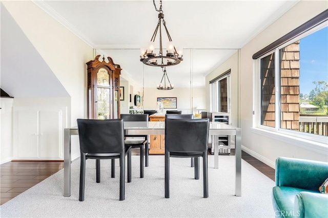38 Canyon Island Dr Unit 38, Newport Beach, CA 92660 - dining space featuring a chandelier, wood finished floors, and crown molding