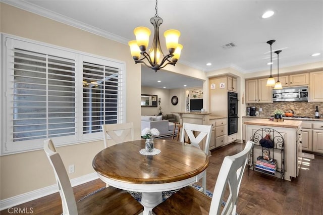 1372 W Sepulveda St, San Pedro, CA 90732 - dining room with dark wood-type flooring, ornamental molding, a chandelier, and recessed lighting