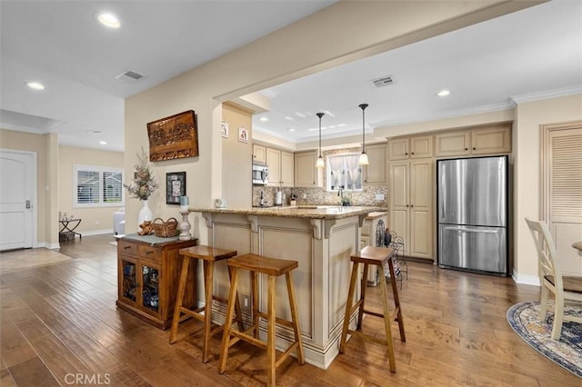 1372 W Sepulveda St, San Pedro, CA 90732 - kitchen with appliances with stainless steel finishes, a kitchen breakfast bar, light stone counters, a peninsula, and tasteful backsplash