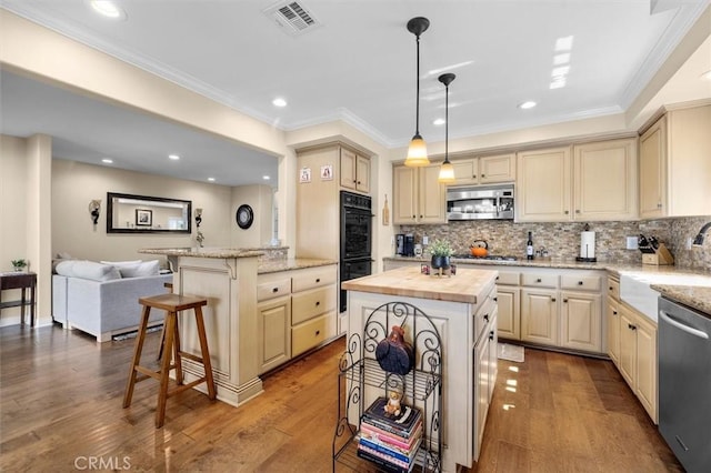 1372 W Sepulveda St, San Pedro, CA 90732 - kitchen with appliances with stainless steel finishes, wood counters, tasteful backsplash, open floor plan, and ornamental molding