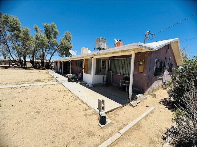 34756 Birch Rd, Barstow, CA 92311 - rear view of house with a chimney and a patio area