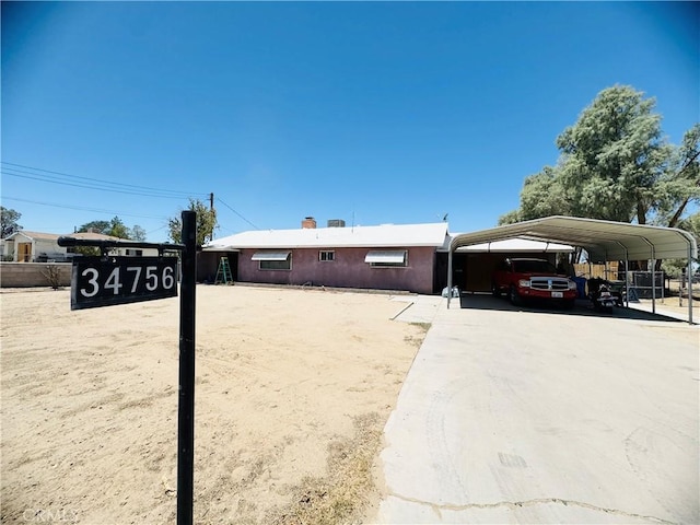 34756 Birch Rd, Barstow, CA 92311 - view of front facade featuring a detached carport and driveway