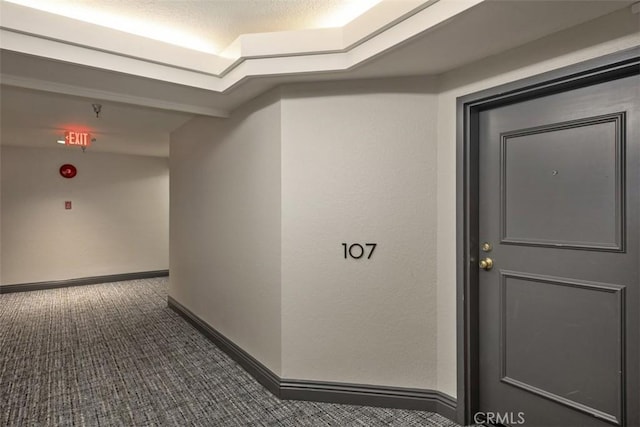 950 Cagney Ln Unit 107, Newport Beach, CA 92663 - hallway with carpet flooring and baseboards