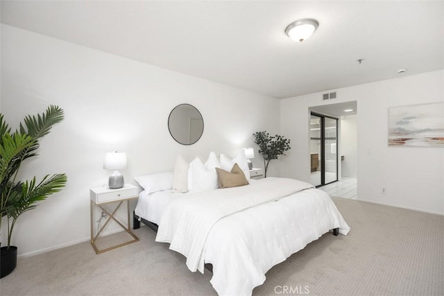 950 Cagney Ln Unit 107, Newport Beach, CA 92663 - bedroom with light carpet and baseboards