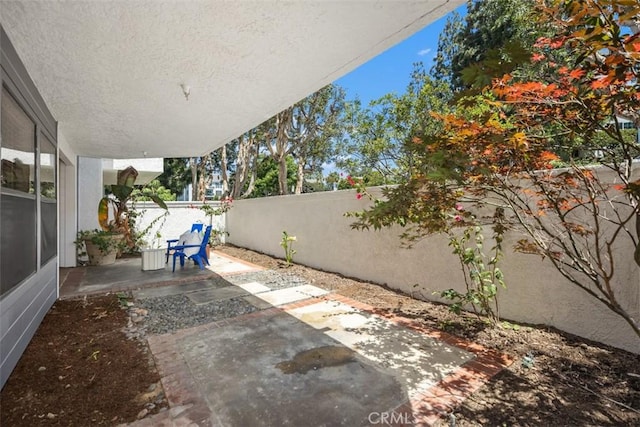 950 Cagney Ln Unit 107, Newport Beach, CA 92663 - fenced backyard featuring a patio area