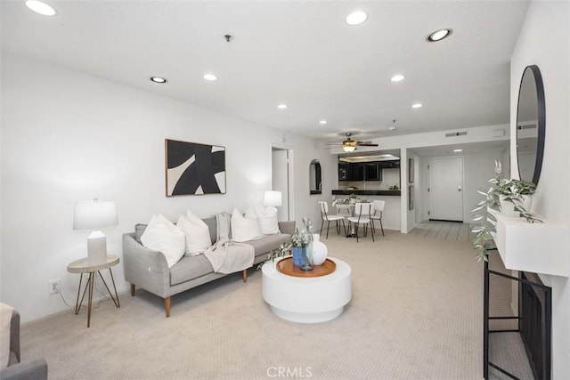 950 Cagney Ln Unit 107, Newport Beach, CA 92663 - living room with light colored carpet, recessed lighting, and ceiling fan