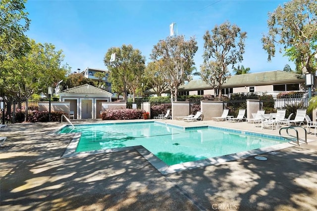 950 Cagney Ln Unit 107, Newport Beach, CA 92663 - community pool featuring a patio