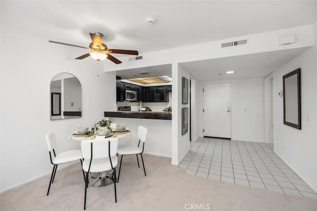 950 Cagney Ln Unit 107, Newport Beach, CA 92663 - dining area featuring light carpet and a ceiling fan