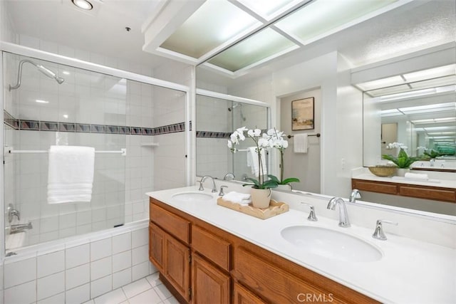 950 Cagney Ln Unit 107, Newport Beach, CA 92663 - bathroom with double vanity, tile patterned flooring, and tiled shower / bath