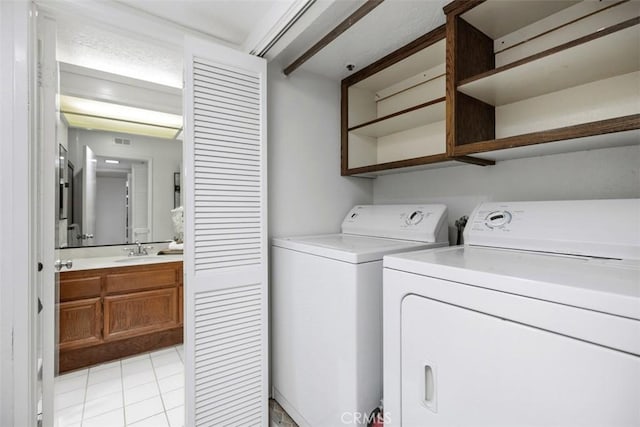 950 Cagney Ln Unit 107, Newport Beach, CA 92663 - laundry area featuring separate washer and dryer and light tile patterned flooring