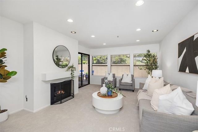 950 Cagney Ln Unit 107, Newport Beach, CA 92663 - carpeted living room featuring recessed lighting and a warm lit fireplace
