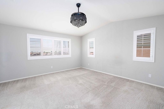 4389 Condor Ave, Fontana, CA 92336 - carpeted empty room with vaulted ceiling and baseboards