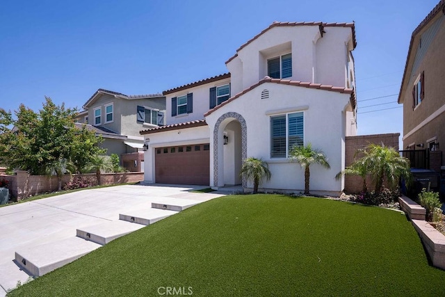 4389 Condor Ave, Fontana, CA 92336 - mediterranean / spanish-style house with stucco siding, a tiled roof, a garage, and concrete driveway